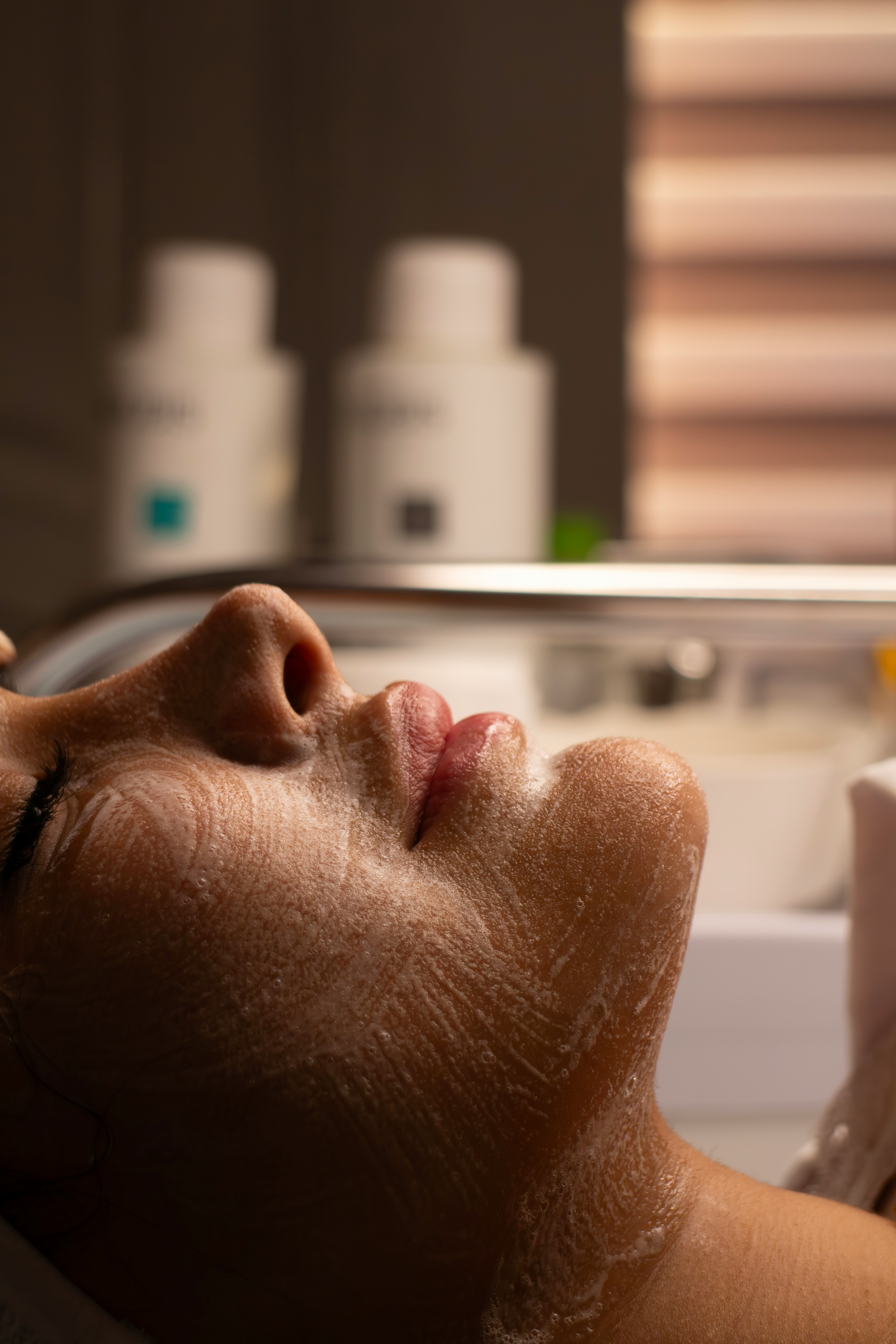 Calm spa with women getting facial